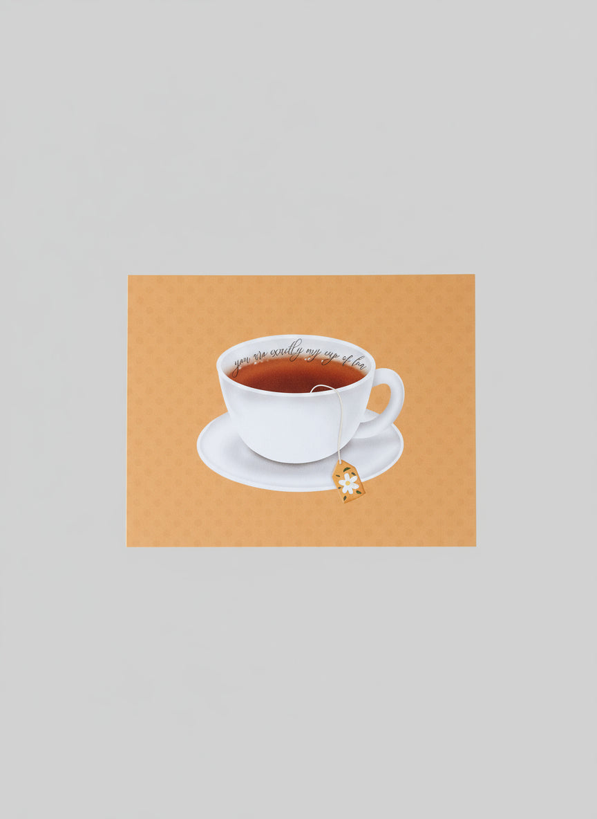 Card with a white cup design held by a hand against a plain background